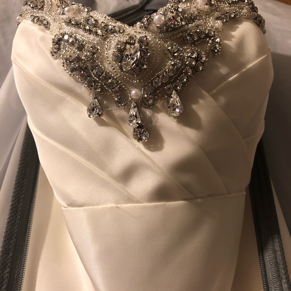 Wedding dress altered to size 2.. added gems/lace